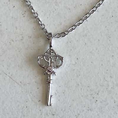 Sterling Silver Necklace With A Delicate Key Pendant 