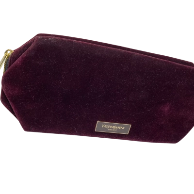 plush burgundy velvet cosmetic pouch from Yves Saint Laurent Beauté features a polished gold-tone zipper pu