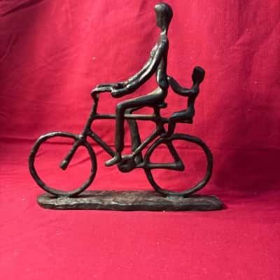 Handcrafted Casted Figurine, Person Doubling another Person on a Bike