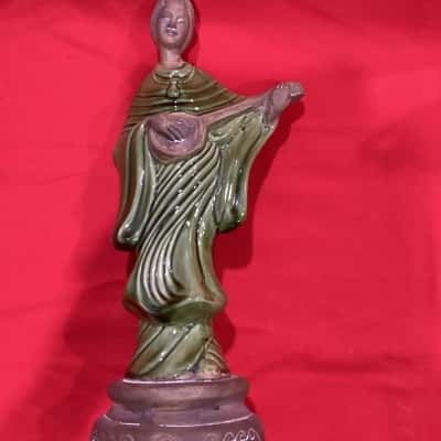 Vintage Ceramic figurine of a woman playing a stringed instrument