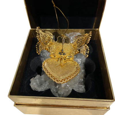 A gold-tone Christmas tree ornament featuring two lovebirds perched on a heart