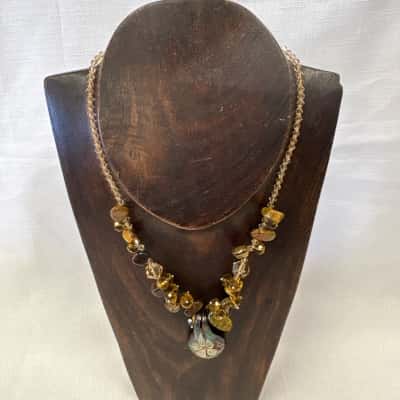  Women's Artisan Made Art Glass Pendant Necklace featuring an Amber & Brown Beaded Design with a Tear drop Shaped Glass with White Floral Motifs Pendant 