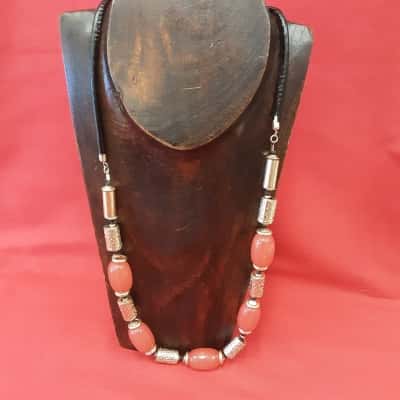 W Lane fashion necklace featuring Coral coloured beads and textured Gold Tone spacers