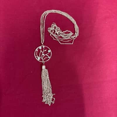  Women's gold Tone Multi chain Tassel Necklace with a Round Openwork floral Motif featuring Clear Rhinestones