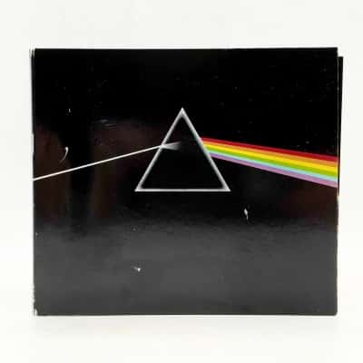 Pink Floyd ‎– The Dark Side Of The Moon - CD, Album, Reissue, Remastered. Packaging: Gatefold Cardboard Sleeve With 12-Page Booklet Which Includes Lyrics. Condition Is Very Good