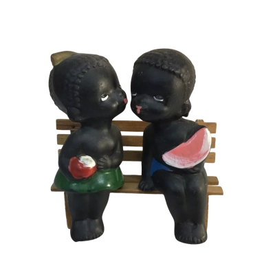 Boy and Girl Figures on a bench seat 