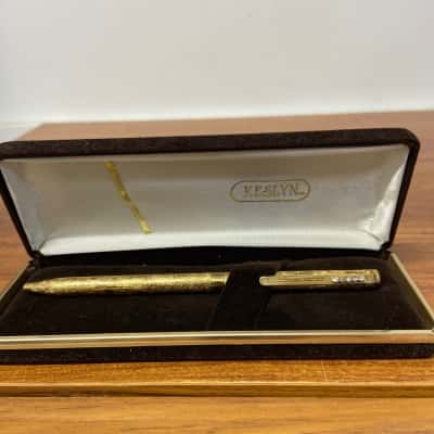 Vintage Keslyn gold coloured and jewelled pen in brown velvet case