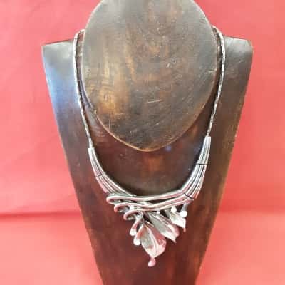 Rosemarie collection Silvertone statement necklace featuring leaf accents along with crystals