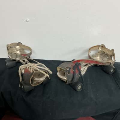 Vintage Germina adjustable metal roller skates with leather straps 