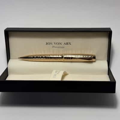 Jos Von Arx Prestige Gold Toned luxury ballpoint pen resting inside its padded presentation gift box