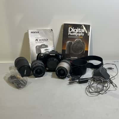 Pentax K100D SLR camera with various lenses + manual