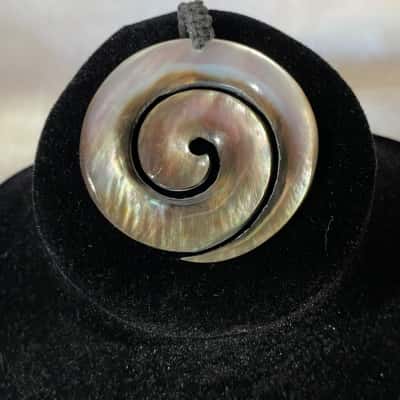 SHELL SPIRAL PENDANT WITH HAND MADE LOOP  