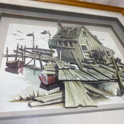 a 3D decoupage framed print by artist Steve Nelsen depicting a coastal dock house scene