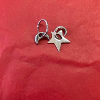  Womens Quirky Moon & Star Silver Coloured Earrings
