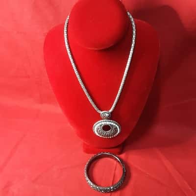  Women's  @ 2pce  set includes Hemalite tone paved Chrystal circle necklace and matching textured gunmetal finish bangle