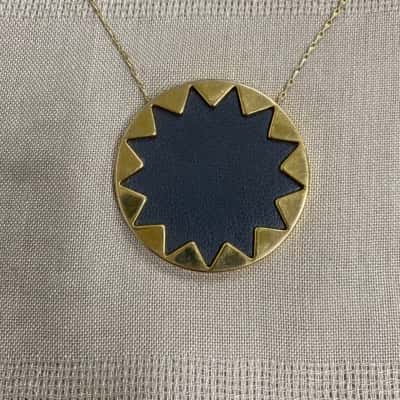  Womens Gold Tone and Black Leather Sun Pendant on Long Chain