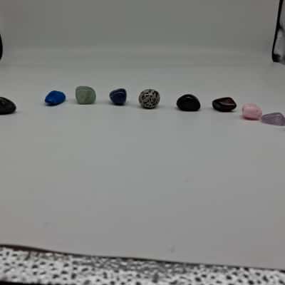 A COLLECTION  OF OF NATURAL TUMBLED GEMSTONES AND HEALING CRYSTALS