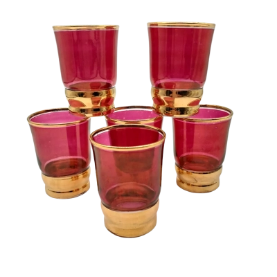 6 red shot glasses with gold band and trim