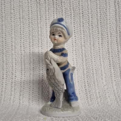 Vintage Porcelain Figurine of a Boy Holding a Fish