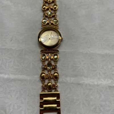 Guess Womens Gold watch with sparkly stones on band 