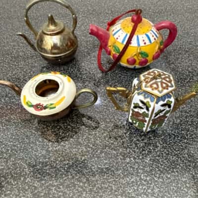 Set of collectible miniature teapots, some of which are ornaments. (B12)