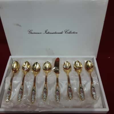Grosvenor International Collection  Set of gold tone spoons and cake set