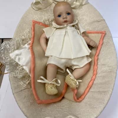 Vintage Porcelain Baby Doll in Bassinet Basket White Outfit Blue Eyes Collectible