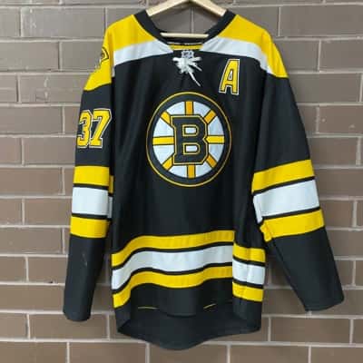 Reebok NHL Mens Size 52 Black/Yellow Bergeron Hockey Jersey