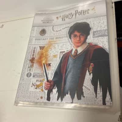 Harry Potter trading cards album with 18 cards