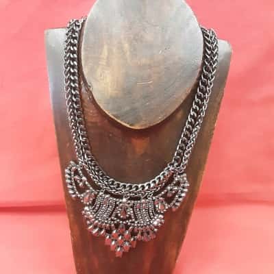 Lovisa black statement necklace featuring large ornate filigree pendant set with multiple black rhinestones