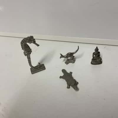 Assorted small pewter figurines seahorse, platypus, kangaroo and buddha