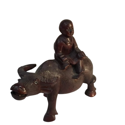 Wooden Vintage Sculpture featuring a child riding a Water Buffalo Approx 16 x 14cm