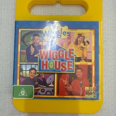 The Wiggles - Wiggle House DVD, released in 2014. It features the second generation of Wiggles: Anthony Field, Lachlan Gillespie, Emma Watkins, and Simon Pryce. The DVD includes 25 new songs(B27)