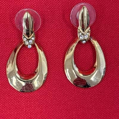 Womens Gold Tone Drop Earrings features a Distinctive Open Teardrop Shape & Rhinestone Embellishments at the Post