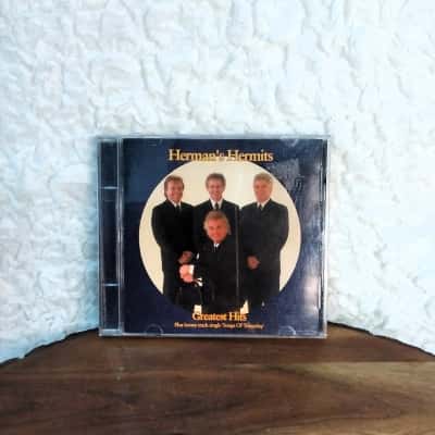 Herman's Hermits Greatest Hits - Signed by all 4 band members Plus bonus track single 'Songs of Yesterday'