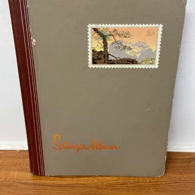 Vintage Stamp Album with assortment of stamps