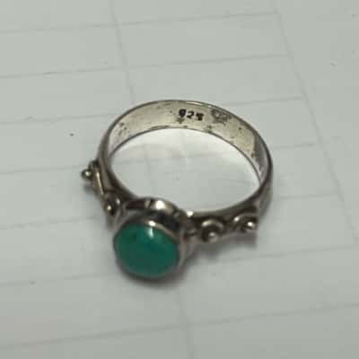silver ring with solid green stone