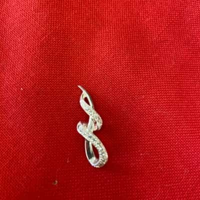  Womens 925 Silver swirl pendant featuring a polished finish with Pave set stones