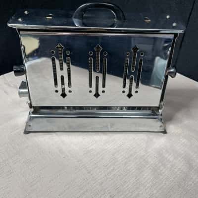 Metelec chrome side-loader 4-slice Toaster. Made in Australia