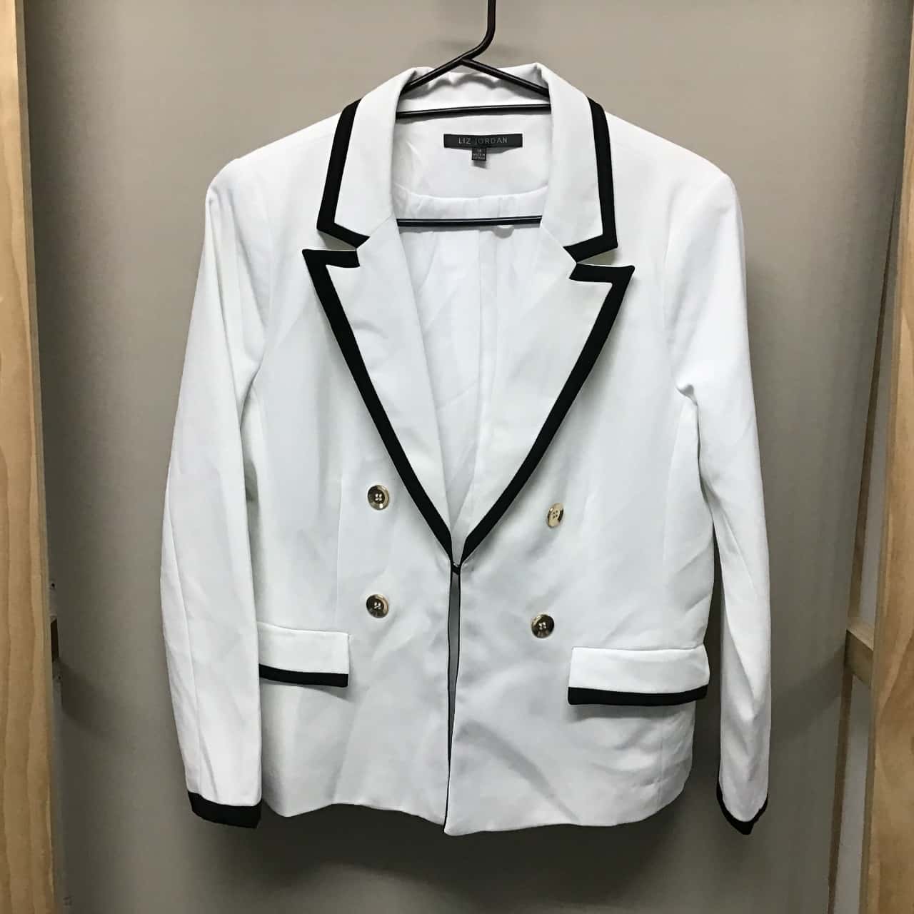 white jacket with black trim