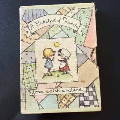 Vintage Joan Walsh Anglund hardcover book with slip cover,published in the 1960s. The titles are A Pocketful of Proverbs.The book has some pen drawings(B21)