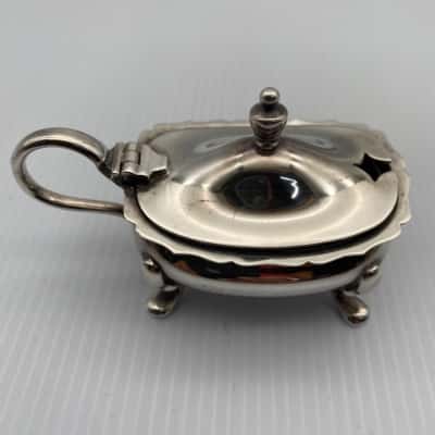 Antique silver sugar tongs and mustard dish