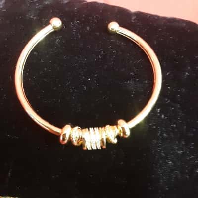  Gold tone bangle ball open torque featuring rhinestones