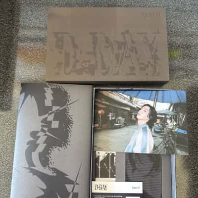 Version 01 of the physical album packaging for D-DAY, the debut solo studio album by South Korean rapper Agust D, also known as Suga from BTS. The album was released on April 21, 2023, includes Outer box/sleeve (visible) Photo book ….(B15)