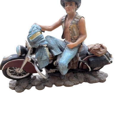Large man on a motorbike statue