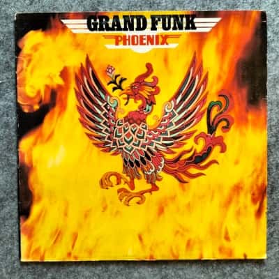 Grand Funk ‎– Phoenix Label: Capitol Records ‎– SW 11099 Format: Vinyl, LP, Album, Gatefold Country: Australia Released: 1972 Genre: Rock Style: Blues Rock, Hard Rock