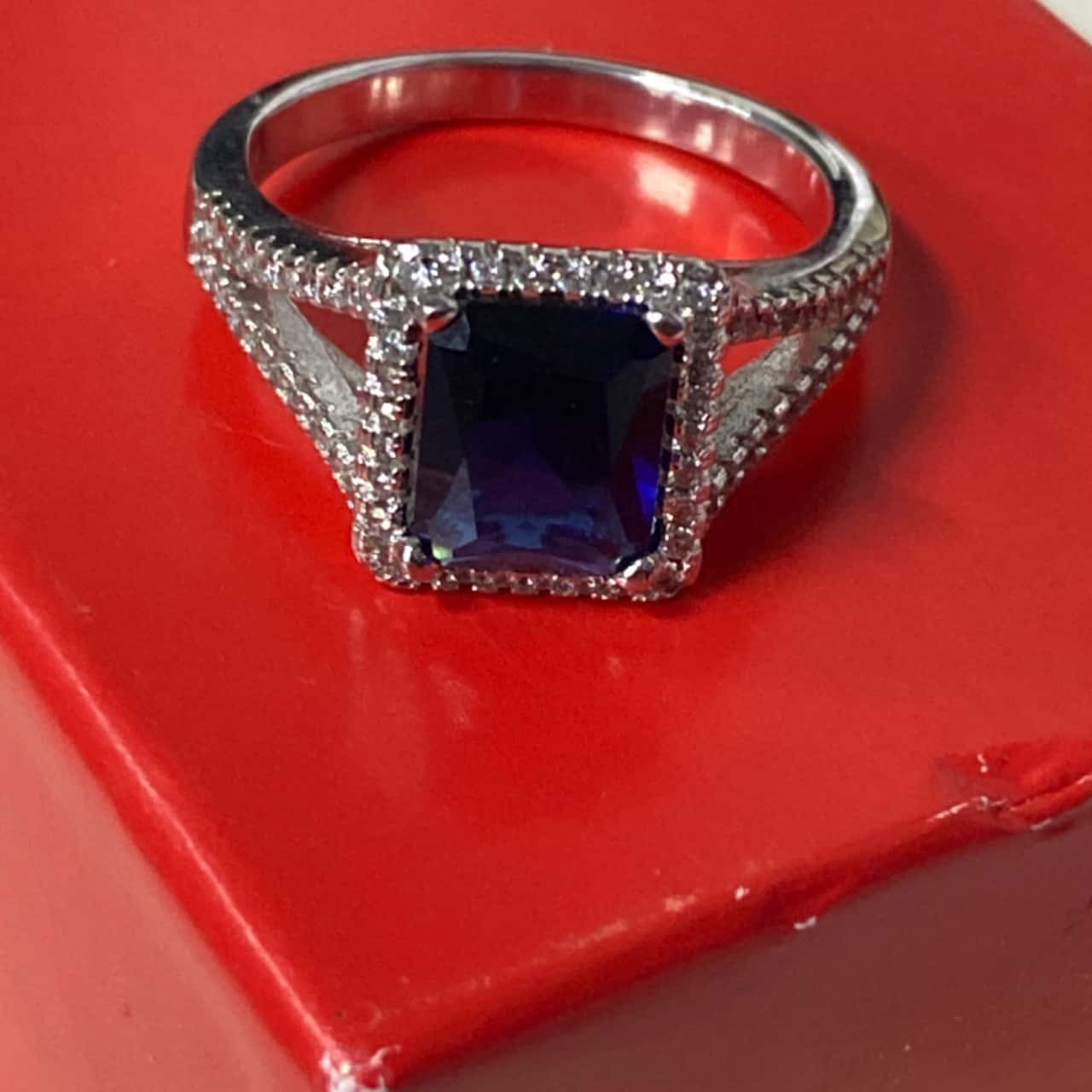 Sterling silver ring with blue stone (s)