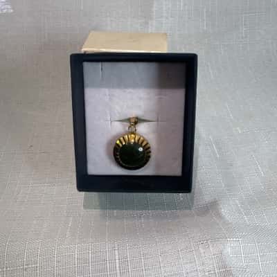 Gold plated pendant with green stone 