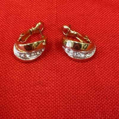  Women'sGold Tone Huggie Earrings featuring Interlocking Bands & a Sparkling Rhinestone Pave Stripe