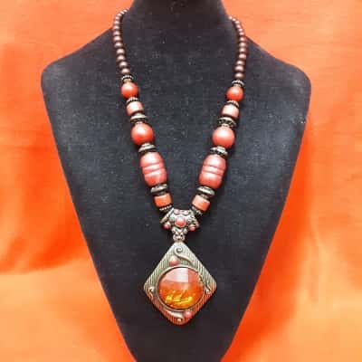 Ladies Wooden Beaded Necklace featuring a Large Amber coloured pendant